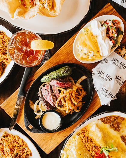 Bee Fajitas, enchiladas, and a taco.